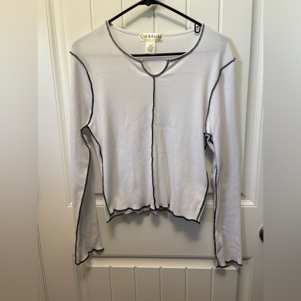 Cut & Paste White Long Sleeve Top. Size Large. Split neck detail. Black trim.